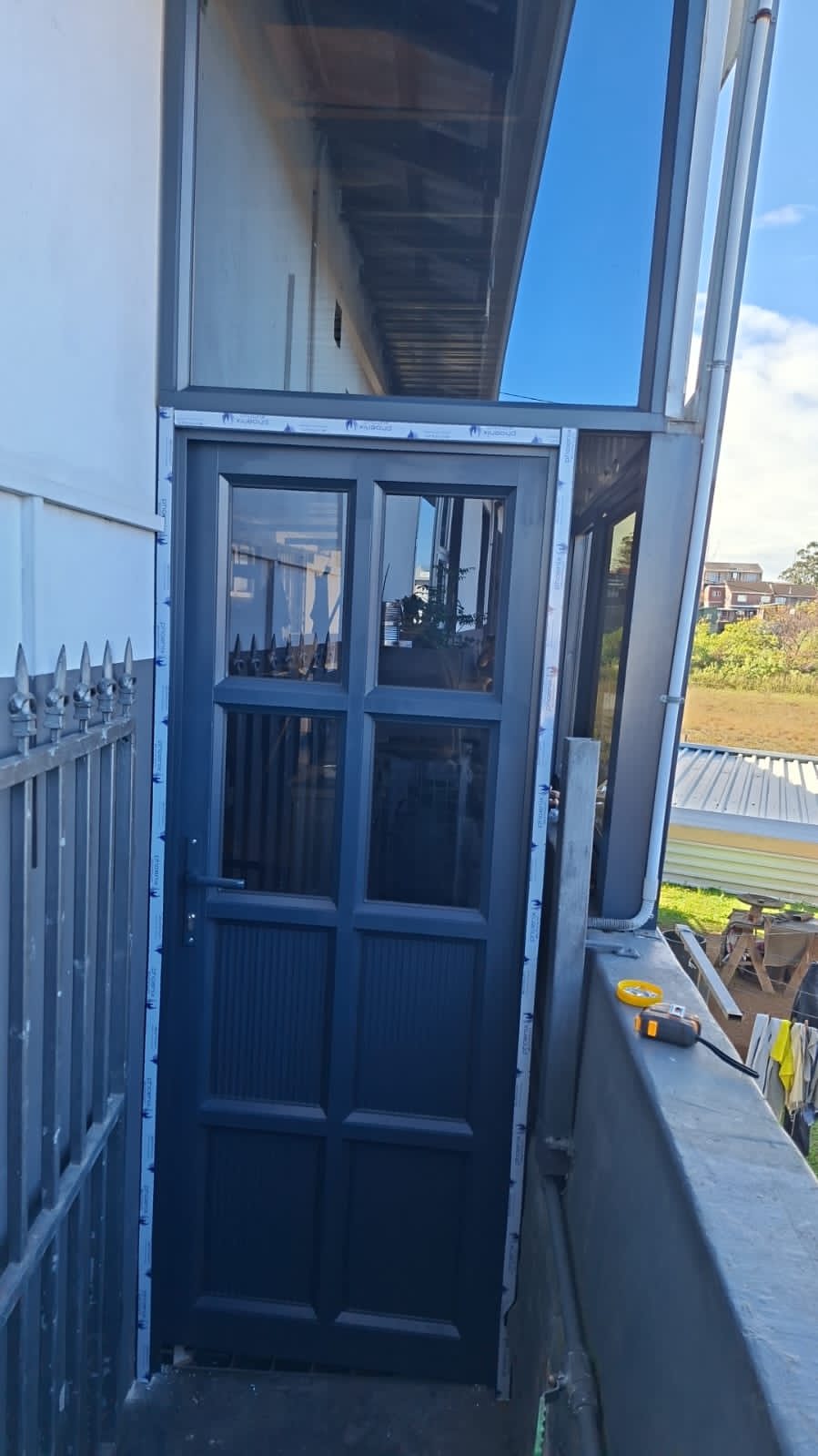 Dark grey aluminium door installed at a Hillcrest home
